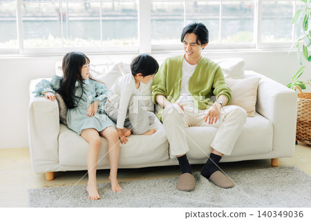 Parents relaxing on the sofa Parents relaxing on the sofa 140349036