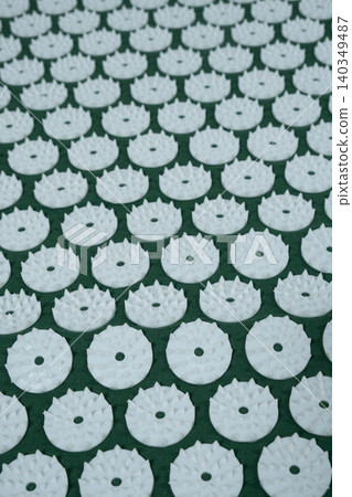 Macro abstract background of green acupuncture massage mat needles. 140349487