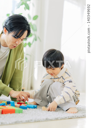 Boy playing with building blocks Boy playing with building blocks 140349692