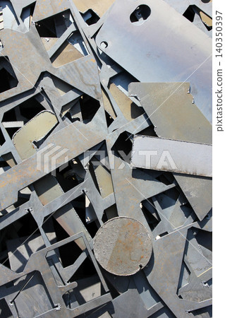 Scrap metal. metal residues after laser cutting Scrap metal. metal residues after laser cutting 140350397