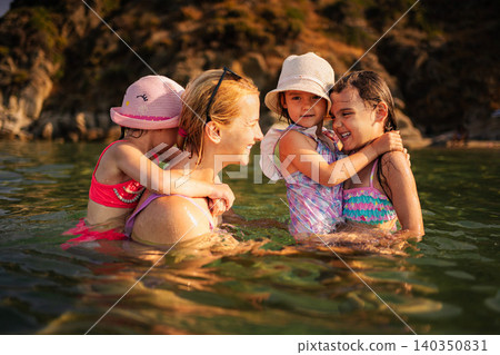 Mother and daughters enjoying summer vacation in Greece Mother and daughters enjoying summer vacation in Greece 140350831