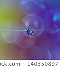 The beautiful gradient background and hanging water droplets create a fantastical atmosphere. 140350897