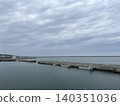A cloudy harbor and breakwater landscape. 140351036