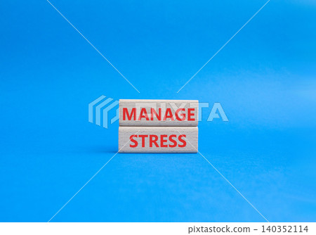 Manage stress symbol. Concept word Manage stress on wooden blocks. Beautiful blue background. Business and Manage stress concept. Copy space Manage stress symbol. Concept word Manage stress on wooden blocks. Beautiful blue background. Business and Manage stress concept. Copy space 140352114