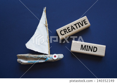 CREATIVE MIND symbol. Concept word CREATIVE MIND on wooden blocks. Beautiful deep blue background with boat. Business and CREATIVE MIND concept. Copy space CREATIVE MIND symbol. Concept word CREATIVE MIND on wooden blocks. Beautiful deep blue background with boat. Business and CREATIVE MIND concept. Copy space 140352149