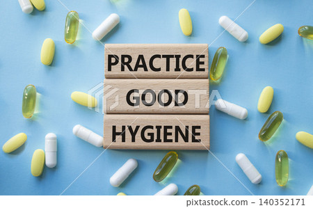 PRACTICE GOOD HYGIENE symbol. Concept words PRACTICE GOOD HYGIENE on wooden blocks. Beautiful blue background with pills. Healthcare and PRACTICE GOOD HYGIENE concept. Copy space. PRACTICE GOOD HYGIENE symbol. Concept words PRACTICE GOOD HYGIENE on wooden blocks. Beautiful blue background with pills. Healthcare and PRACTICE GOOD HYGIENE concept. Copy space. 140352171