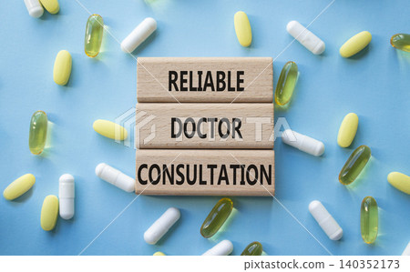 Reliable doctor consultation symbol. Concept words Reliable doctor consultation on wooden blocks. Beautiful blue background with pills. Healthcare and Reliable doctor consultation concept. Copy space. Reliable doctor consultation symbol. Concept words Reliable doctor consultation on wooden blocks. Beautiful blue background with pills. Healthcare and Reliable doctor consultation concept. Copy space. 140352173