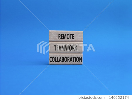 Remote teamwork collaboration symbol. Concept word Remote teamwork collaboration on wooden blocks. Beautiful blue background. Business and Remote teamwork collaboration. Copy space Remote teamwork collaboration symbol. Concept word Remote teamwork collaboration on wooden blocks. Beautiful blue background. Business and Remote teamwork collaboration. Copy space 140352174