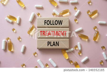 Follow Treatment Plan symbol. Concept words Follow Treatment Plan on wooden blocks. Beautiful pink background with pills. Healthcare and Follow Treatment Plan concept. Copy space. Follow Treatment Plan symbol. Concept words Follow Treatment Plan on wooden blocks. Beautiful pink background with pills. Healthcare and Follow Treatment Plan concept. Copy space. 140352185