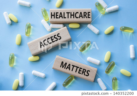 Healthcare Access Matters symbol. Concept words Healthcare Access Matters on wooden blocks. Beautiful blue background with pills. Healthcare and Healthcare Access Matters concept. Copy space. Healthcare Access Matters symbol. Concept words Healthcare Access Matters on wooden blocks. Beautiful blue background with pills. Healthcare and Healthcare Access Matters concept. Copy space. 140352200