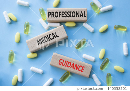 PROFESSIONAL MEDICAL GUIDANCE symbol. Concept words PROFESSIONAL MEDICAL GUIDANCE on wooden blocks. Beautiful blue background with pills. Healthcare and PROFESSIONAL MEDICAL GUIDANCE concept. Copy PROFESSIONAL MEDICAL GUIDANCE symbol. Concept words PROFESSIONAL MEDICAL GUIDANCE on wooden blocks. Beautiful blue background with pills. Healthcare and PROFESSIONAL MEDICAL GUIDANCE concept. Copy 140352201