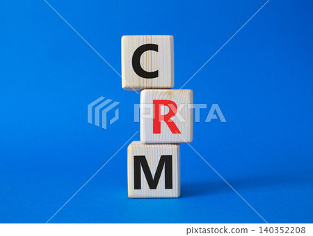 CRM - Customer relationship management symbol. Concept word CRM on wooden cubes. Beautiful blue background. Business and CRM concept. Copy space. CRM - Customer relationship management symbol. Concept word CRM on wooden cubes. Beautiful blue background. Business and CRM concept. Copy space. 140352208