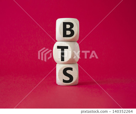 BTS symbol. Wooden cubes with word BTS. Beautiful red background. BTS concept. Copy space. BTS symbol. Wooden cubes with word BTS. Beautiful red background. BTS concept. Copy space. 140352264
