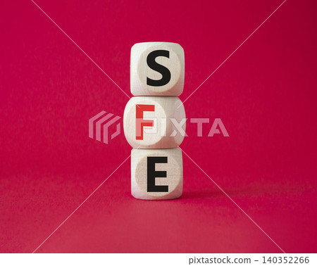 SFE - Sales Force Effectiveness. Wooden cubes with word SFE. Beautiful red background. Business and Sales Force Effectiveness concept. Copy space. SFE - Sales Force Effectiveness. Wooden cubes with word SFE. Beautiful red background. Business and Sales Force Effectiveness concept. Copy space. 140352266