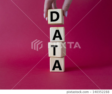 Data symbol. Concept word Data on wooden cubes. Businessman hand. Beautiful red background. Business and Data concept. Copy space. 140352288