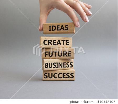 Business success symbol. Wooden blocks with words Ideas create future business success. Beautiful orange background. Business and Business success concept. Copy space 140352307