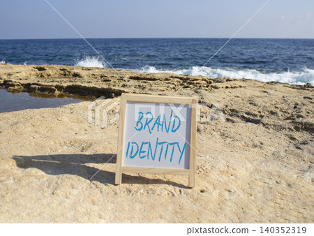 Brand Identity symbol. Blackboard with Concept words Brand Identity. Beautiful sea background. Business and Brand Identity concept. Copy space. 140352319