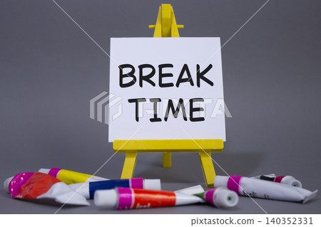Break Time symbol. Concept word Break Time on wooden blocks. Beautiful grey background with paints and easel. Business and Break Time concept. Copy space Break Time symbol. Concept word Break Time on wooden blocks. Beautiful grey background with paints and easel. Business and Break Time concept. Copy space 140352331