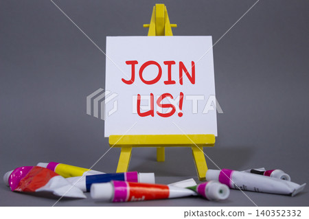 Join us symbol. Concept word Join us on wooden blocks. Beautiful grey background with paints and easel. Business and Join us concept. Copy space Join us symbol. Concept word Join us on wooden blocks. Beautiful grey background with paints and easel. Business and Join us concept. Copy space 140352332