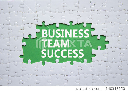 Business Team Success symbol. White puzzle with words Business Team Success. Beautiful green background. Business concept. Copy space. Business Team Success symbol. White puzzle with words Business Team Success. Beautiful green background. Business concept. Copy space. 140352350
