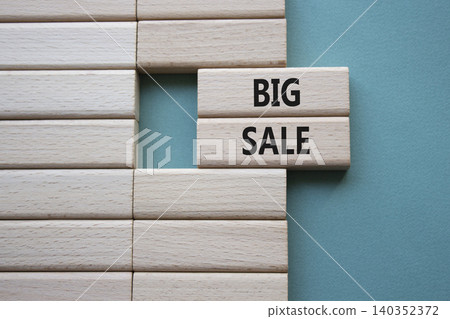BIG SALE symbol. Concept word BIG SALE on wooden blocks. Beautiful grey green background. Business and BIG SALE concept. Copy space 140352372