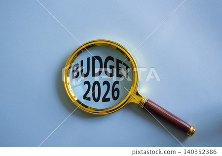 Budget 2026 symbol. Magnifying Glass with words Budget 2026. Beautiful blue background. Business and Budget 2026 concept. Copy space. Budget 2026 symbol. Magnifying Glass with words Budget 2026. Beautiful blue background. Business and Budget 2026 concept. Copy space. 140352386