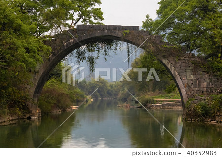 Scenic view of Fuli Bridge, a historic stone arch bridge built more than 500 years ago Scenic view of Fuli Bridge, a historic stone arch bridge built more than 500 years ago 140352983
