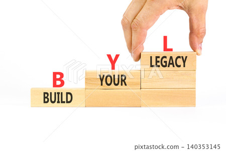 BYL build your legacy symbol. Concept words BYL build your legacy on beautiful wooden blocks. Beautiful white background. Businessman hand. Business BYL build your legacy concept. Copy space BYL build your legacy symbol. Concept words BYL build your legacy on beautiful wooden blocks. Beautiful white background. Businessman hand. Business BYL build your legacy concept. Copy space 140353145