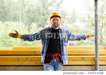 Happy construction worker showing welcome gesture Happy construction worker showing welcome gesture 140353198