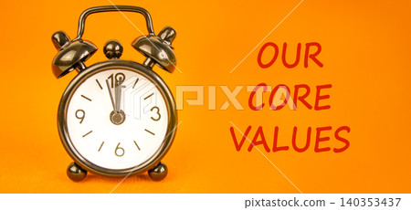 Our core values words symbol. Concept words Our core values on beautiful white paper. Beautiful orange background. Black alarm clock. Business our core values motivational support concept. Copy space. 140353437