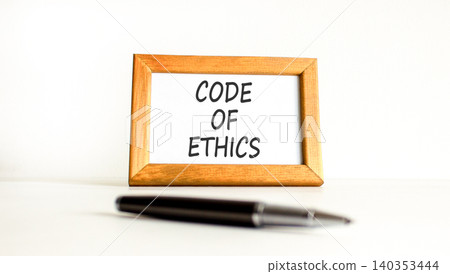Code of ethics words symbol. Concept words Code of ethics on beautiful wooden picture frame. Beautiful white background. Business Code of ethics concept. Copy space. Code of ethics words symbol. Concept words Code of ethics on beautiful wooden picture frame. Beautiful white background. Business Code of ethics concept. Copy space. 140353444