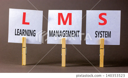 LMS learning management system symbol. Concept words LMS learning management system on beautiful white papers. Beautiful grey background. Business LMS learning management system concept. Copy space LMS learning management system symbol. Concept words LMS learning management system on beautiful white papers. Beautiful grey background. Business LMS learning management system concept. Copy space 140353523