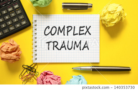 Complex trauma words symbol. Concept words Complex trauma on beautiful white note. Beautiful yellow background. Black pen. Black calculator. Psychological complex trauma support concept. Copy space. 140353730
