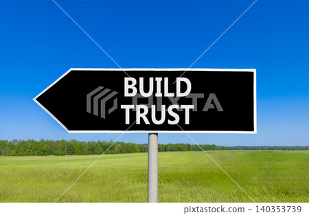 Build trust symbol. Concept words Build trust on beautiful black road sign. Beautiful blue sky green grass field background. Business and build trust concept, copy space. Build trust symbol. Concept words Build trust on beautiful black road sign. Beautiful blue sky green grass field background. Business and build trust concept, copy space. 140353739