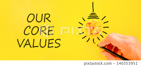 Our core values words symbol. Concept words Our core values on beautiful yellow paper. Beautiful yellow background. Businessman hand. Business our core values motivational support concept. Copy space. Our core values words symbol. Concept words Our core values on beautiful yellow paper. Beautiful yellow background. Businessman hand. Business our core values motivational support concept. Copy space. 140353951