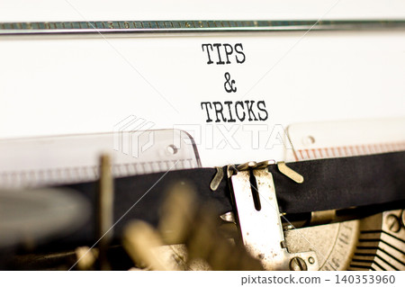 Tips and tricks words symbol. Concept words Tips and tricks typed on beautiful old retro typewriter. Beautiful white background. Business tips and tricks motivational support concept. Copy space. Tips and tricks words symbol. Concept words Tips and tricks typed on beautiful old retro typewriter. Beautiful white background. Business tips and tricks motivational support concept. Copy space. 140353960