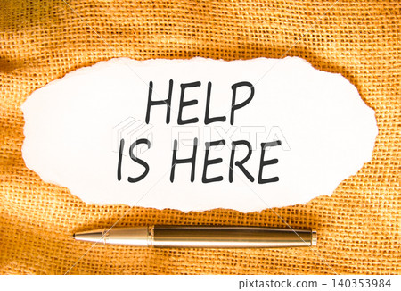 Help is here and support words symbol. Concept words Help is here on beautiful white paper. Beautiful canvas background. Business help is here and support concept. Copy space. Help is here and support words symbol. Concept words Help is here on beautiful white paper. Beautiful canvas background. Business help is here and support concept. Copy space. 140353984