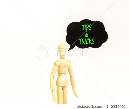 Tips and tricks symbol. Concept words Tips and tricks on beautiful black speech bubble. Beautiful white background. Businessman model. Business tips and tricks motivational support concept. Copy space Tips and tricks symbol. Concept words Tips and tricks on beautiful black speech bubble. Beautiful white background. Businessman model. Business tips and tricks motivational support concept. Copy space 140354061