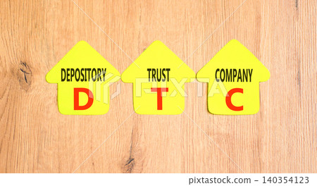DTC depository trust company symbol. Concept words DTC depository trust company on beautiful yellow paper houses. Beautiful wooden background. Business DTC depository trust company concept. Copy space DTC depository trust company symbol. Concept words DTC depository trust company on beautiful yellow paper houses. Beautiful wooden background. Business DTC depository trust company concept. Copy space 140354123