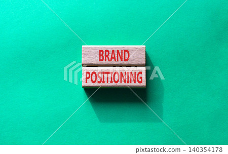 Brand Positioning symbol. Concept word Brand Positioning on wooden blocks. Beautiful green background. Business and Brand Positioning concept. Copy space Brand Positioning symbol. Concept word Brand Positioning on wooden blocks. Beautiful green background. Business and Brand Positioning concept. Copy space 140354178