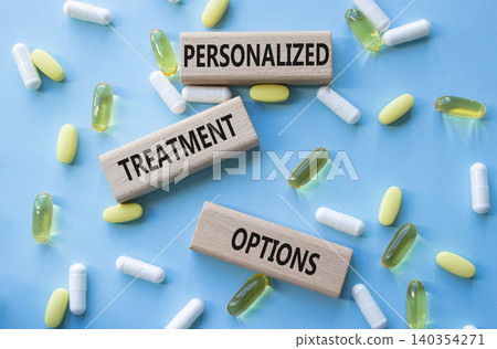 Personalized treatment options symbol. Concept words Personalized treatment options on wooden blocks. Beautiful blue background with pills. Healthcare and Personalized treatment options concept. Copy Personalized treatment options symbol. Concept words Personalized treatment options on wooden blocks. Beautiful blue background with pills. Healthcare and Personalized treatment options concept. Copy 140354271