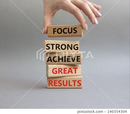 Great Results symbol. Wooden blocks with words Focus strong achieve great results. Businessman hand. Beautiful grey background. Business and Great Results concept. Copy space Great Results symbol. Wooden blocks with words Focus strong achieve great results. Businessman hand. Beautiful grey background. Business and Great Results concept. Copy space 140354304