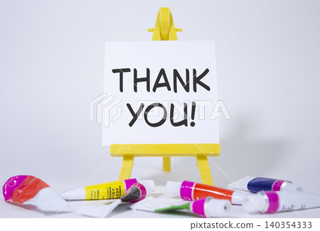 Thank you symbol. Wooden blocks with words Thank you. Beautiful white background with paints and easel. Business and Thank you concept. Copy space. Thank you symbol. Wooden blocks with words Thank you. Beautiful white background with paints and easel. Business and Thank you concept. Copy space. 140354333