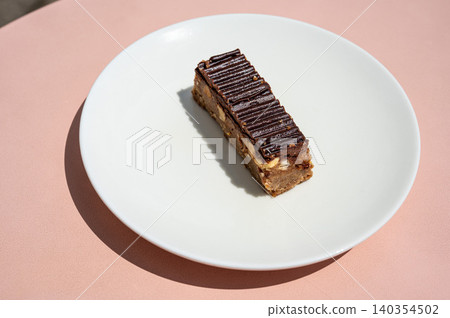 Chocolate bar with caramel and roasted peanuts Chocolate bar with caramel and roasted peanuts 140354502