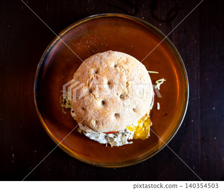 Ciabatta burger with egg, lettuce and tomato Ciabatta burger with egg, lettuce and tomato 140354503