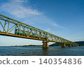 A local train running across the Yoshinogawa Bridge between Sako Station and Yoshinari Station on the Kotoku Line in Tokushima Prefecture. 140354836