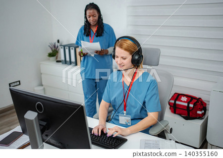 Healthcare professionals providing telemedicine support for patients 140355160