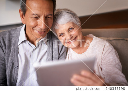 Senior, couple and portrait with tablet on sofa for online bingo, crossword puzzle and internet games with smile. Elderly, man and woman with face and happiness with technology for web news in home Senior, couple and portrait with tablet on sofa for online bingo, crossword puzzle and internet games with smile. Elderly, man and woman with face and happiness with technology for web news in home 140355198