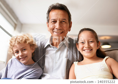 Portrait, hug and home with grandfather, grandkids and bonding together with love and weekend break. Face, family and old man with children and embrace with fun and playful with vacation and cheerful Portrait, hug and home with grandfather, grandkids and bonding together with love and weekend break. Face, family and old man with children and embrace with fun and playful with vacation and cheerful 140355222