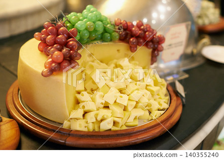 Food, grapes and cheese in restaurant buffet for catering service, snack selection and banquet for eating. Cafeteria, fine dining and closeup of table for lunch, supper and dinner event for wellness Food, grapes and cheese in restaurant buffet for catering service, snack selection and banquet for eating. Cafeteria, fine dining and closeup of table for lunch, supper and dinner event for wellness 140355240